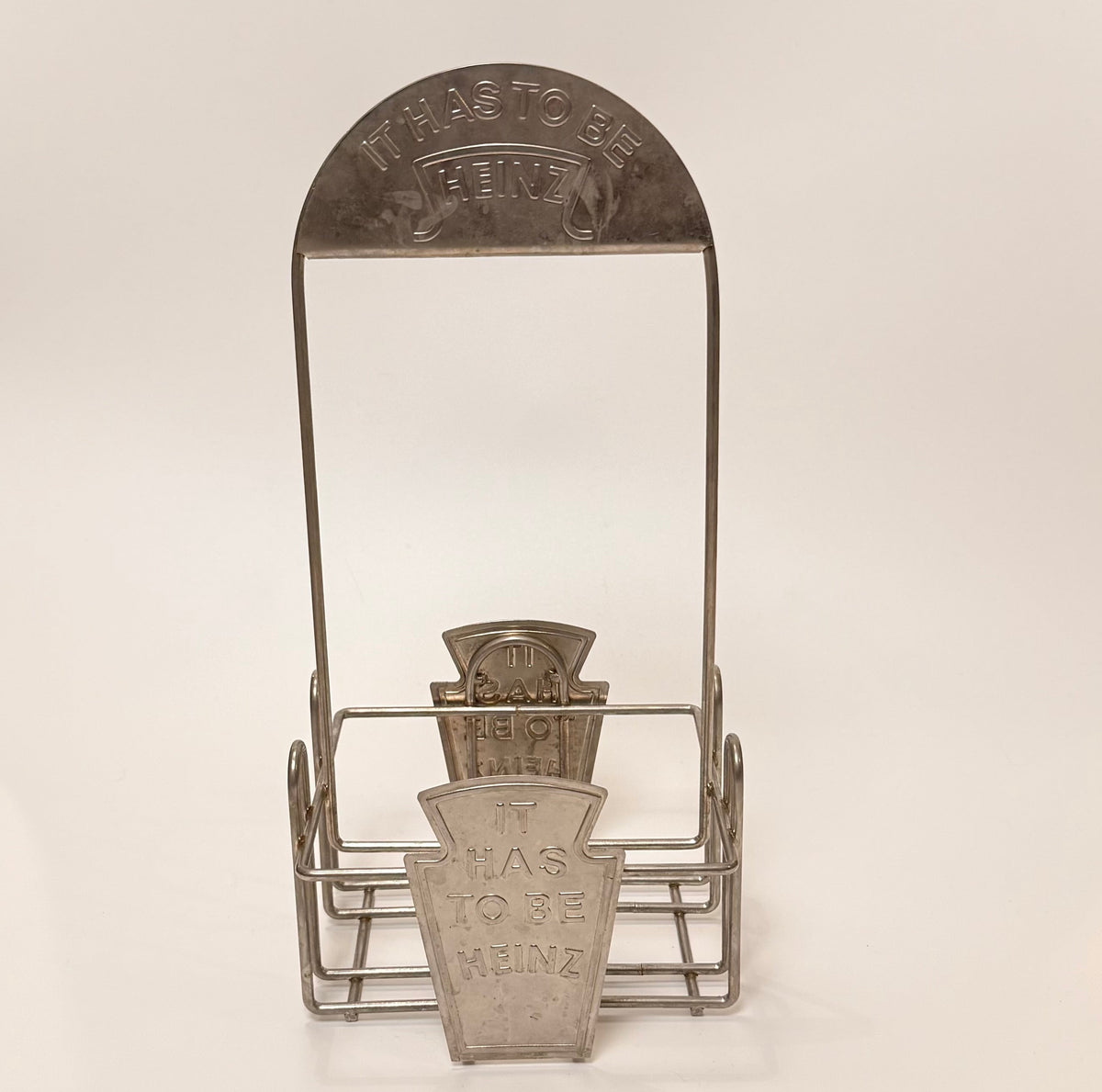 Vintage Heinz flaskeholder / condiment caddy i metal – “It Has To Be Heinz”